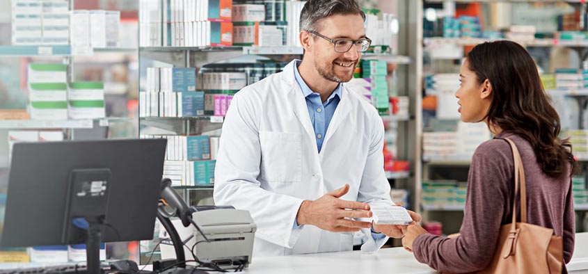 A pharmacist explaining a clients prescription